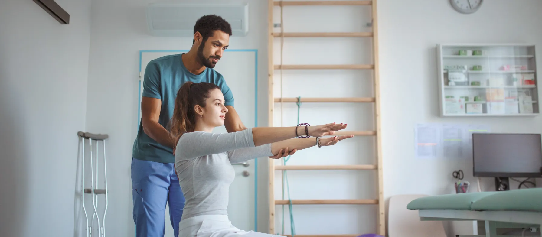 Physical therapist helping a patient 