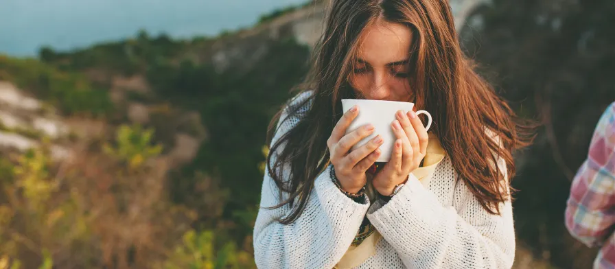 Staying Health While on the Road, girl drinking coffee